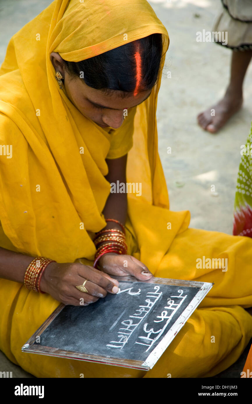 Indian rural woman writing on slate uttar pradesh India Asia Stock Photo -  Alamy