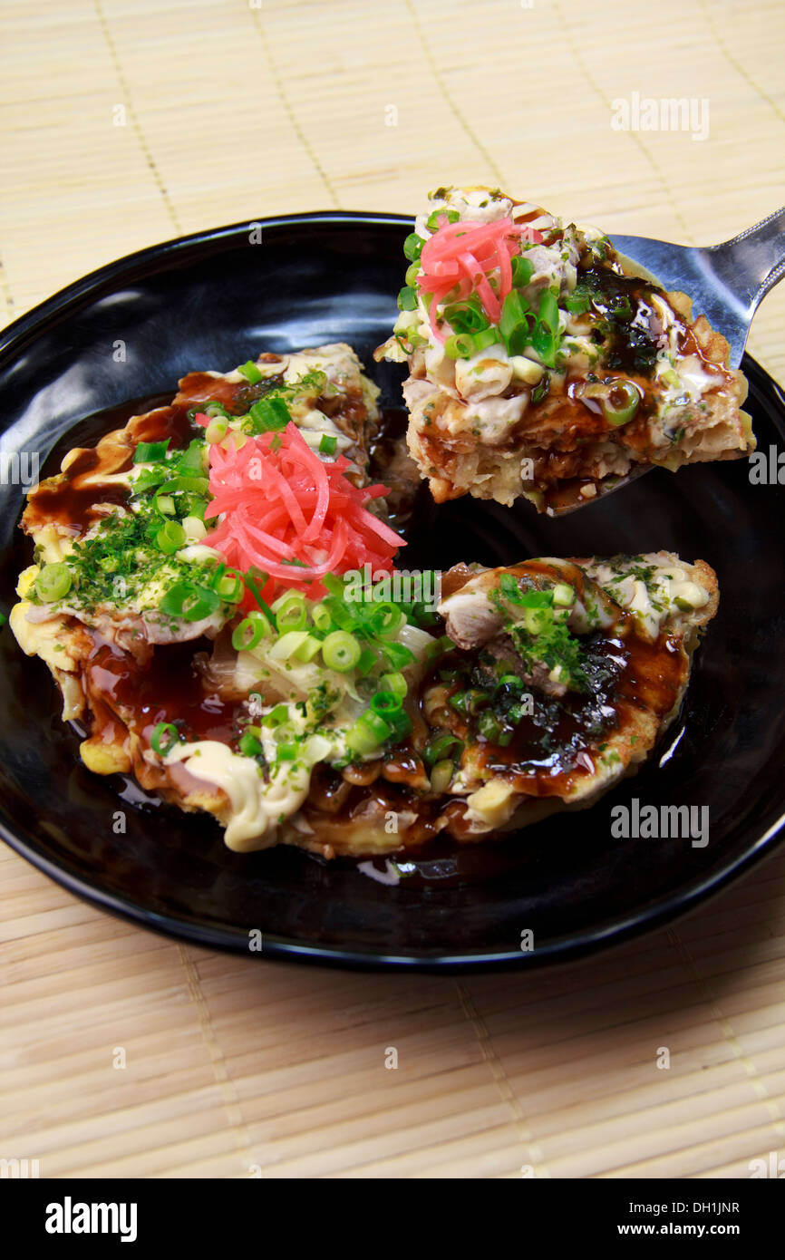 Okonomiyaki (Japanese savory pancake) Stock Photo