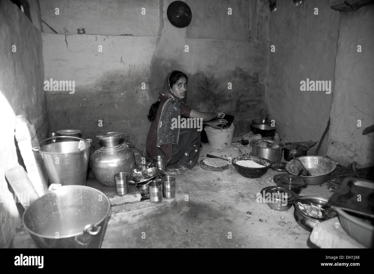 Indian rural village girl in kitchen uttar pradesh India Asia Stock Photo