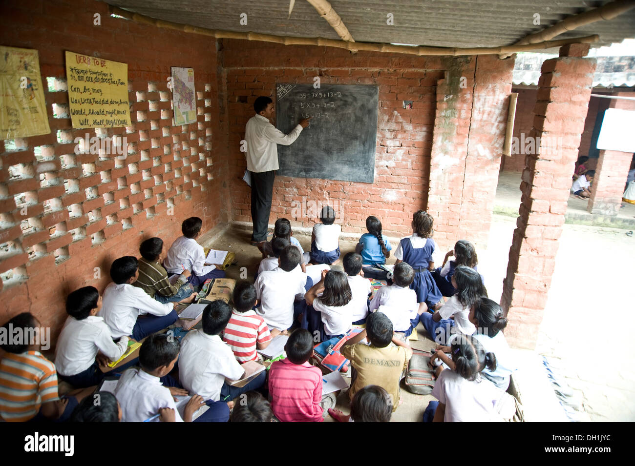Indian rural teacher teaching in classroom village Uttar Pradesh India Asia Stock Photo