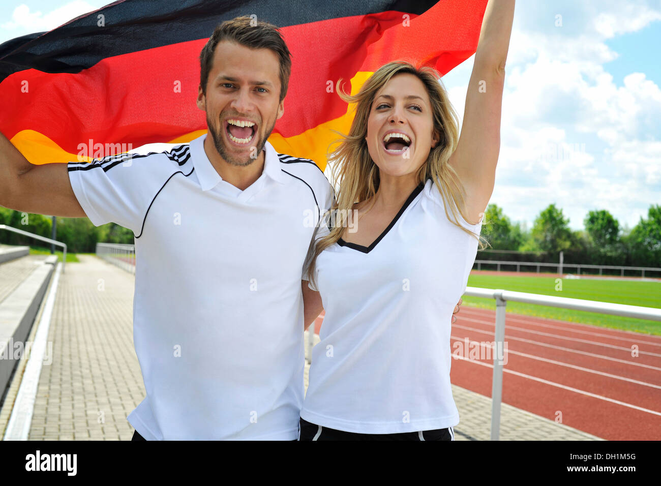 Soccer fans waving German flag, Munich, Bavaria, Germany Stock Photo