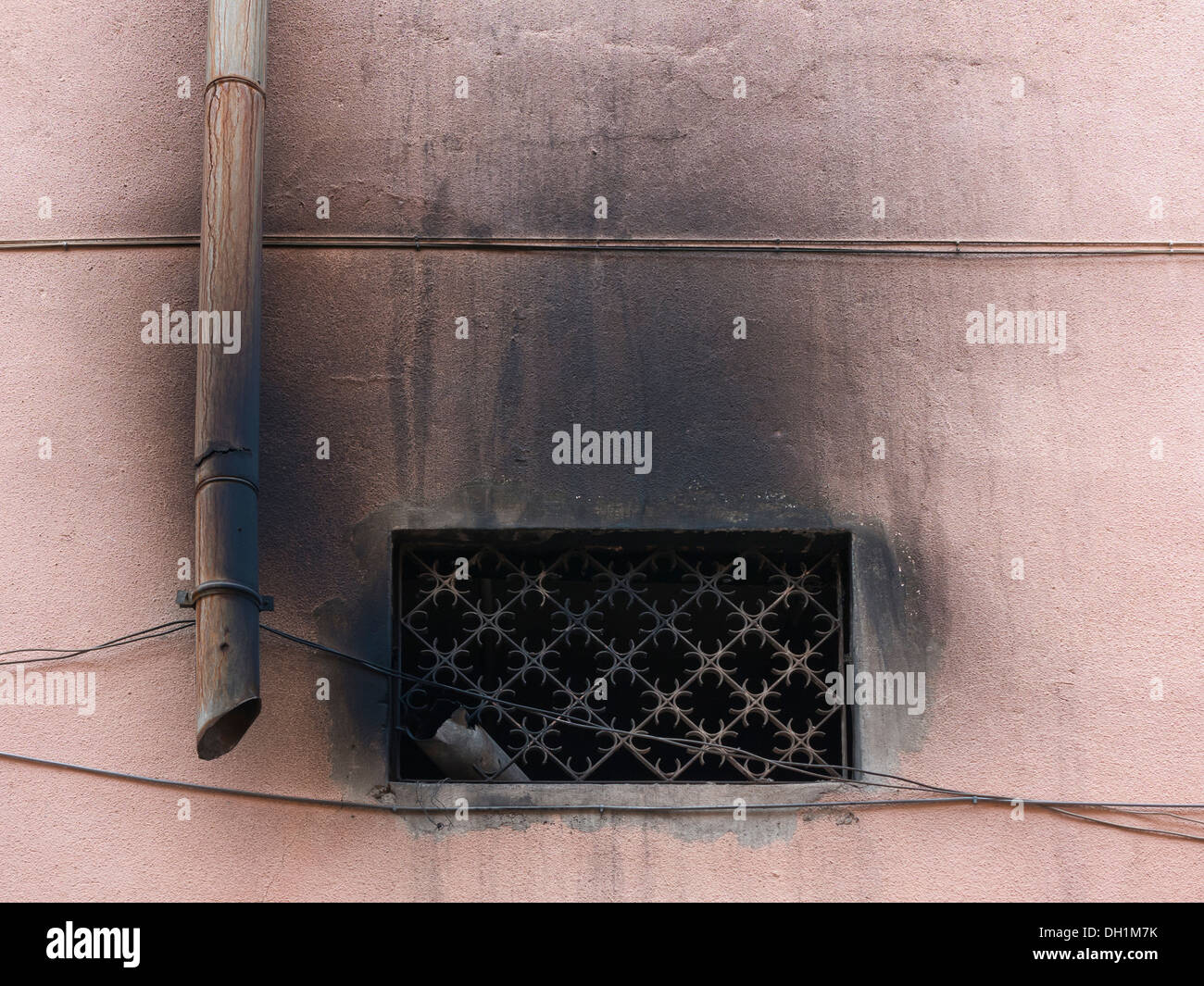 Close up of ornate air vent in side of building showing smoke and fume pollution Morocco Stock Photo