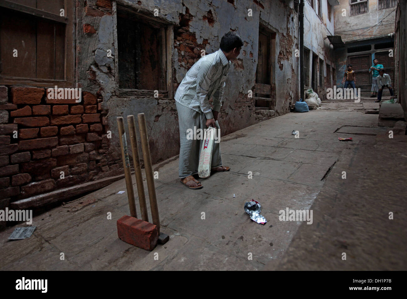 Young boys playing cricket at Varanasi Uttar Pradesh India Stock Photo