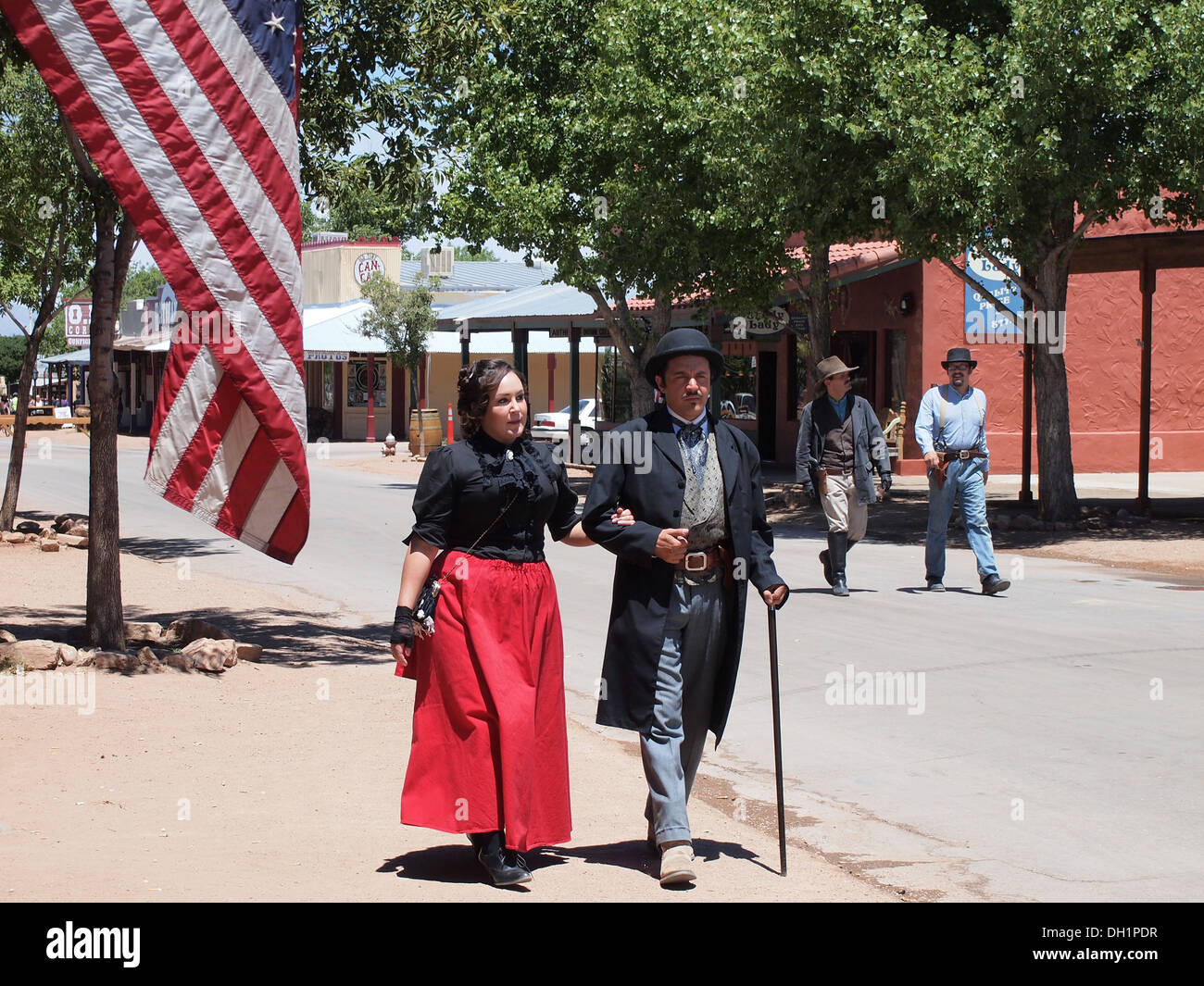 Actors portraying Big Nose Kate and Doc Holliday stroll through the historic American Old West town of Tombstone, Arizona, USA Stock Photo