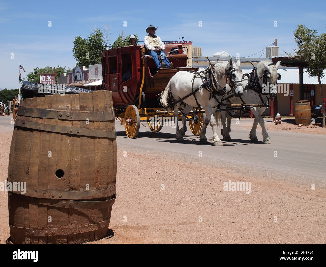 Actor portraying stagecoach driver drives through in the historical American Old West Town of Tombstone, Arizona, USA Stock Photo