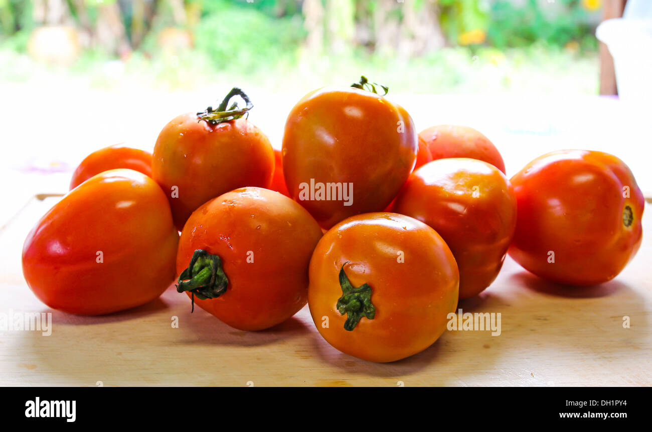 Tomatoes on a cutting board Stock Photo - Alamy