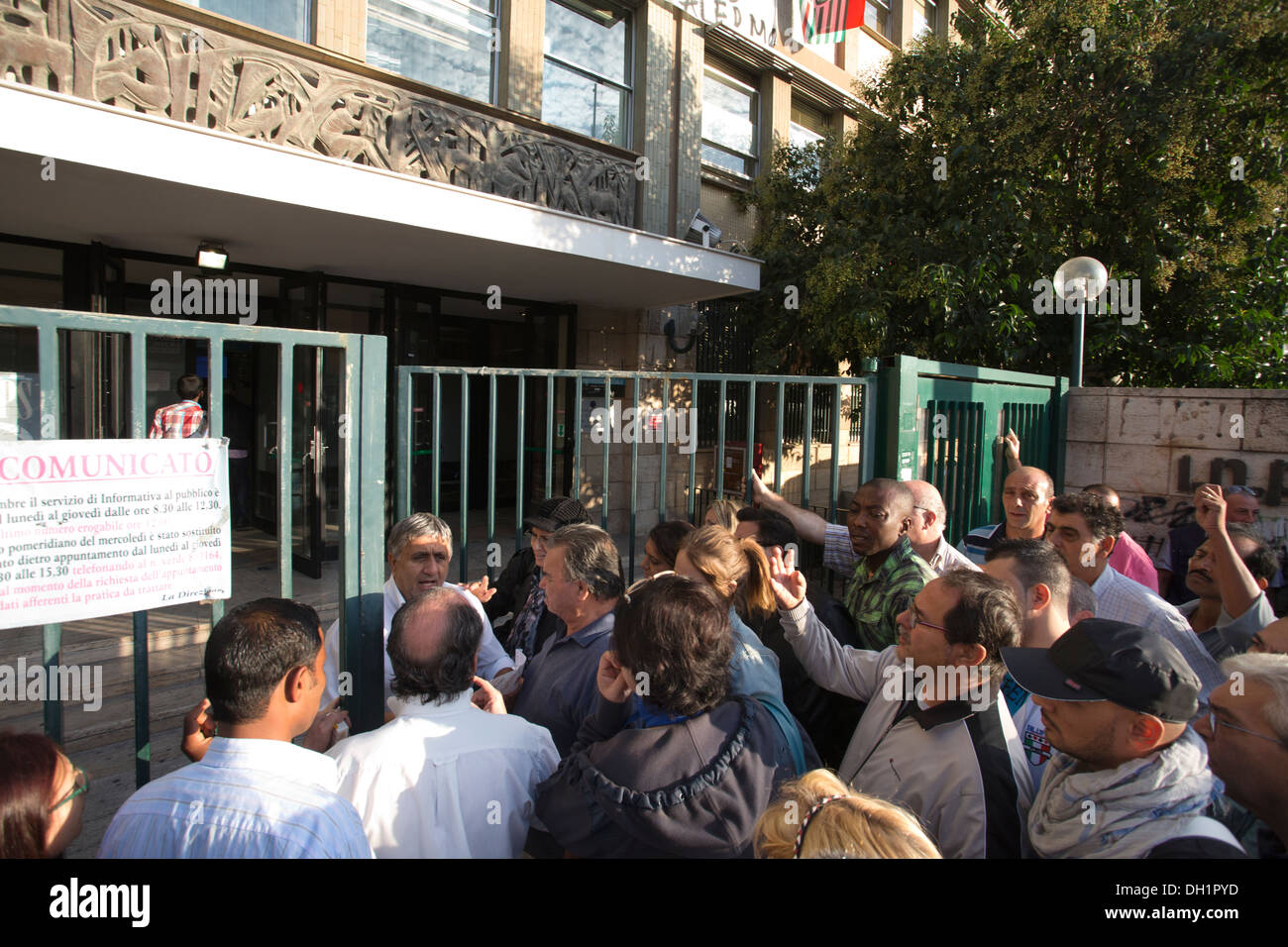 Civilians queuing at the Palermo Unemployment and Pensions Centre, in the centre of the capital of Sicilia. Stock Photo