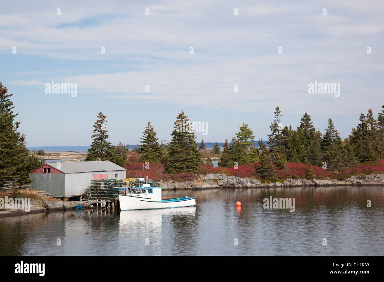 lobster fishing smack at a picturesque wharf with lobster pots in Nova Scotia Canada Stock Photo