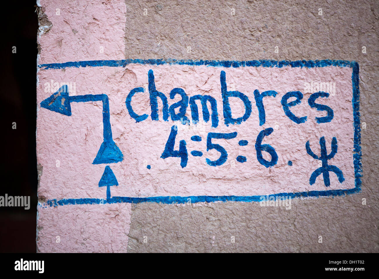 Close up of room numbers and directions painted in Berber style on a hotel wall in Morocco Stock Photo