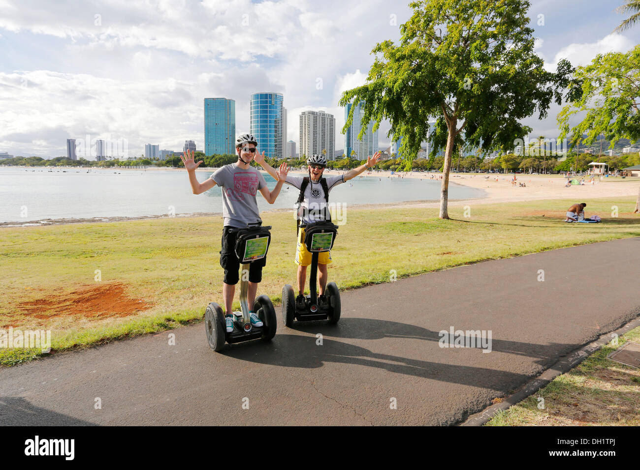 Segway riders on the beach at Waikiki, Honolulu, O'ahu, Hawai'i, USA, America Stock Photo