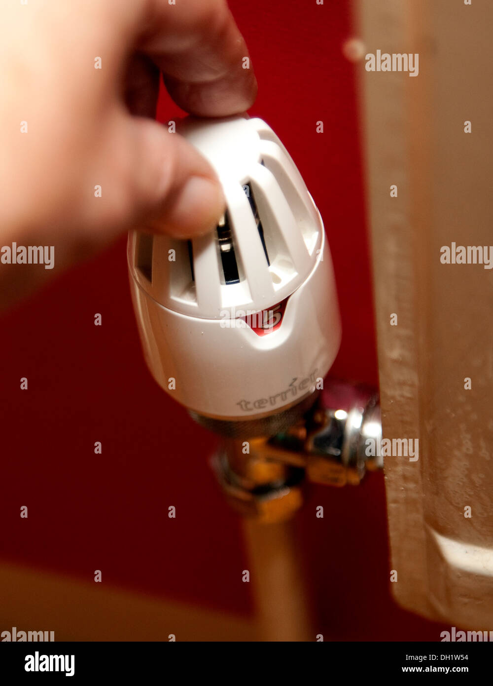 Adjusting thermostatic radiator valve, London Stock Photo Alamy