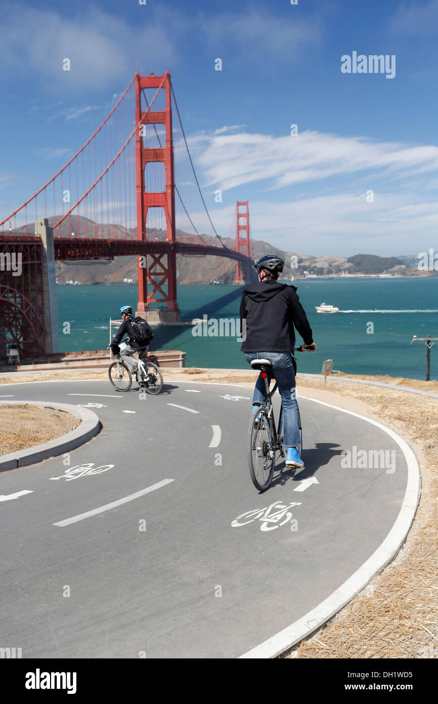 Cyclists, Golden Gate Bridge at the back, San Francisco, California, USA Stock Photo