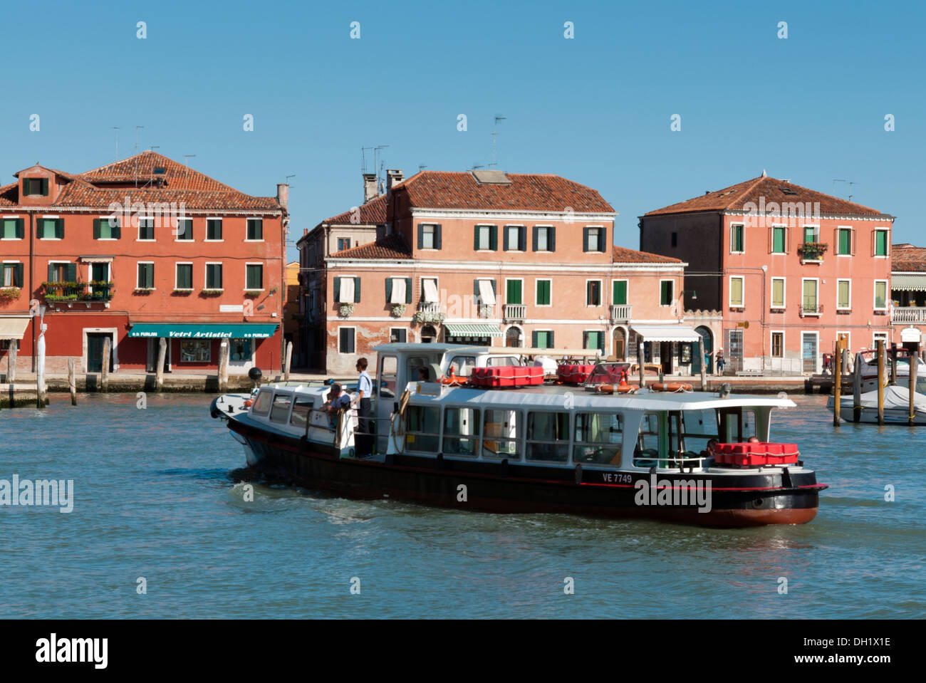 Ferry in a canal at Murano Island, Murano, Venice province, Veneto, Italy Stock Photo