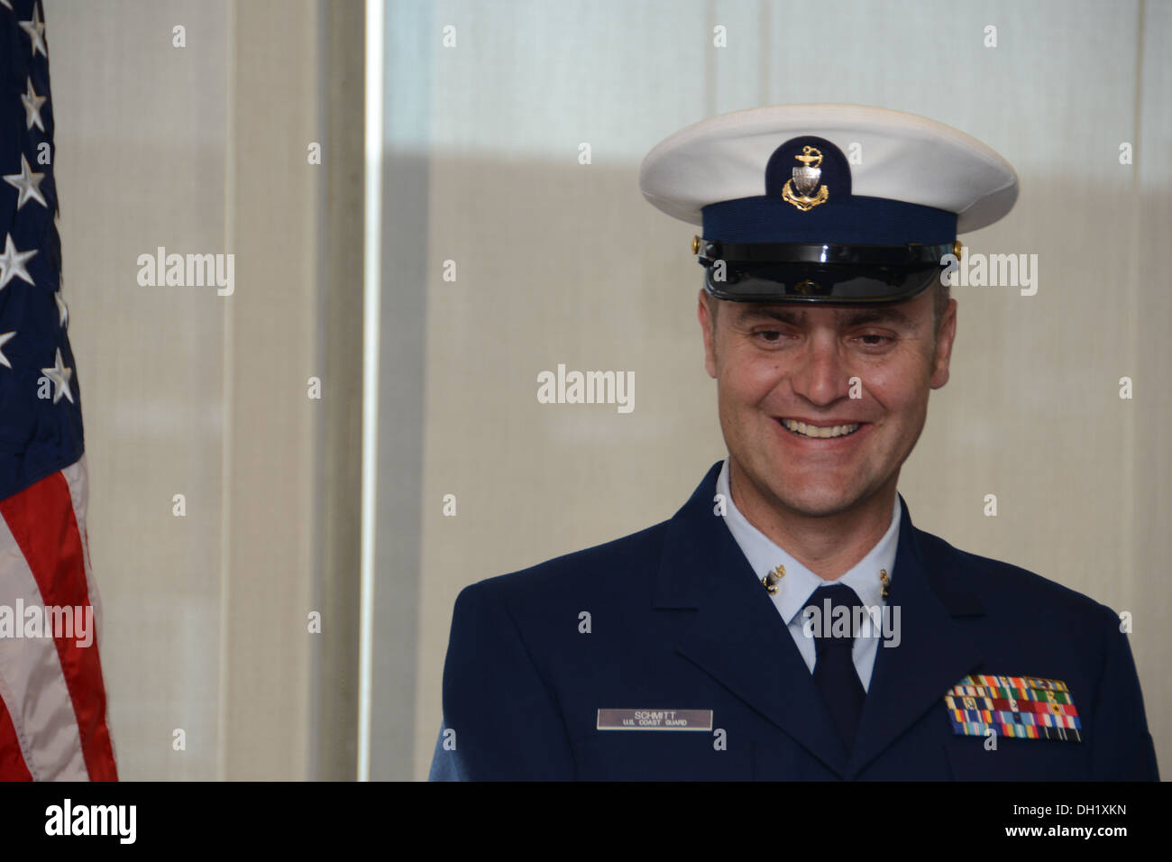 Chief Petty Officer Jeffrey Schmitt, a command center chief for the Coast Guard 9th District in Cleveland, smiles during his retirement ceremony held at the Anthony J. Celebrezze Federal Building in Cleveland on Oct. 11, 2013. Schmitt retired from the Coa Stock Photo