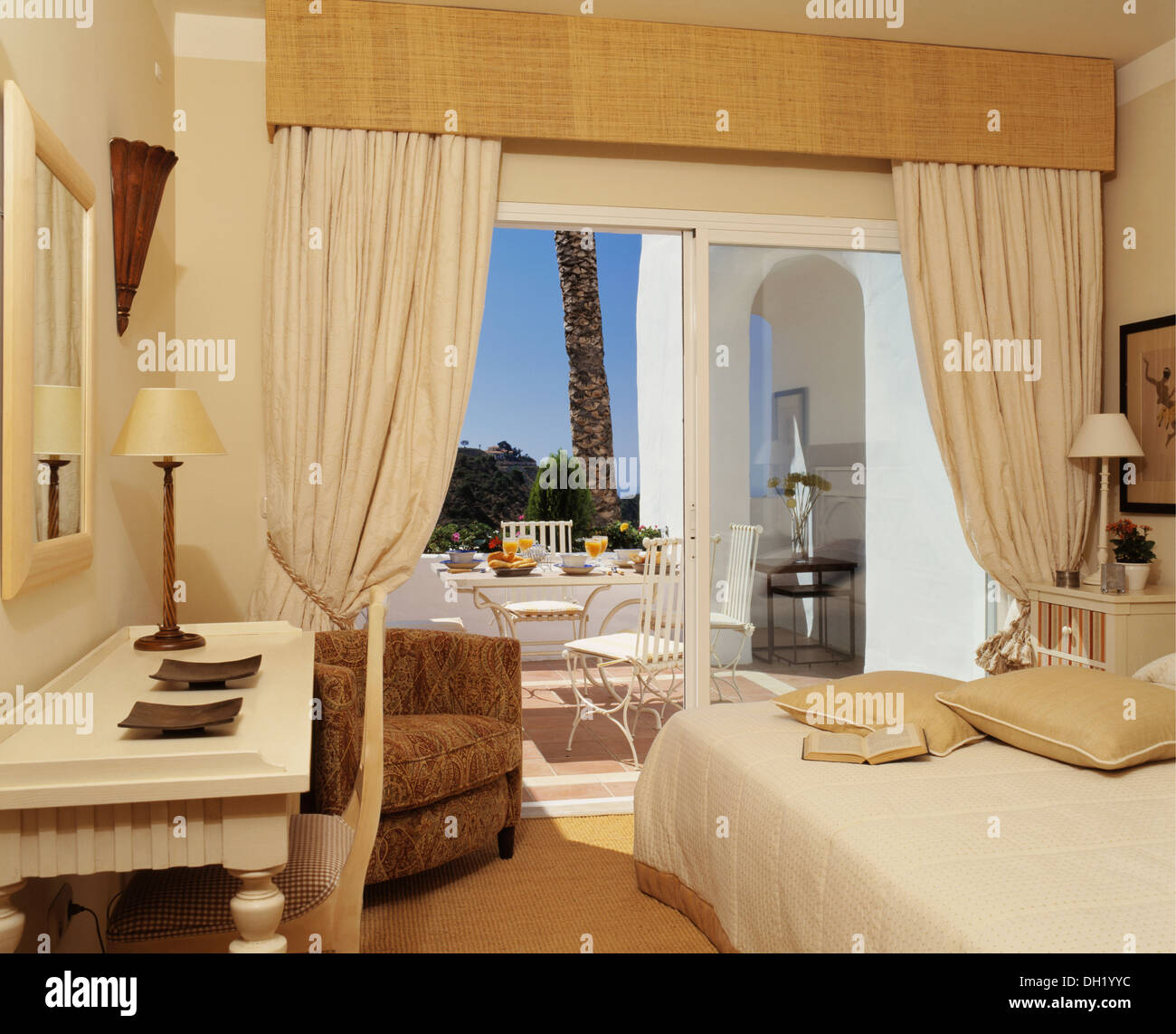 Pelmet And Cream Drapes On Glass Doors To Terrace In Spanish Villa