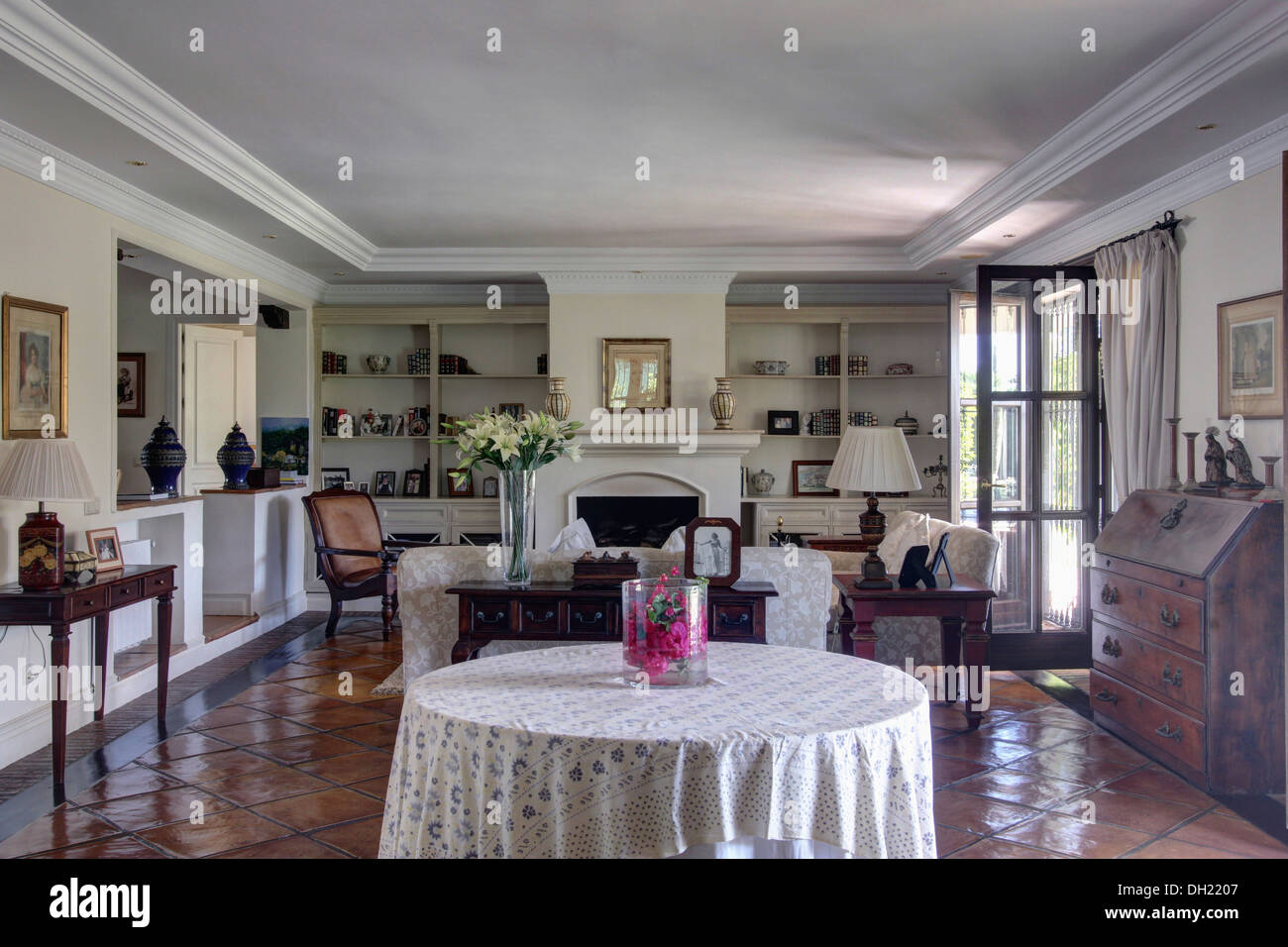 White Cloth On Circular Table In Traditional Spanish Living
