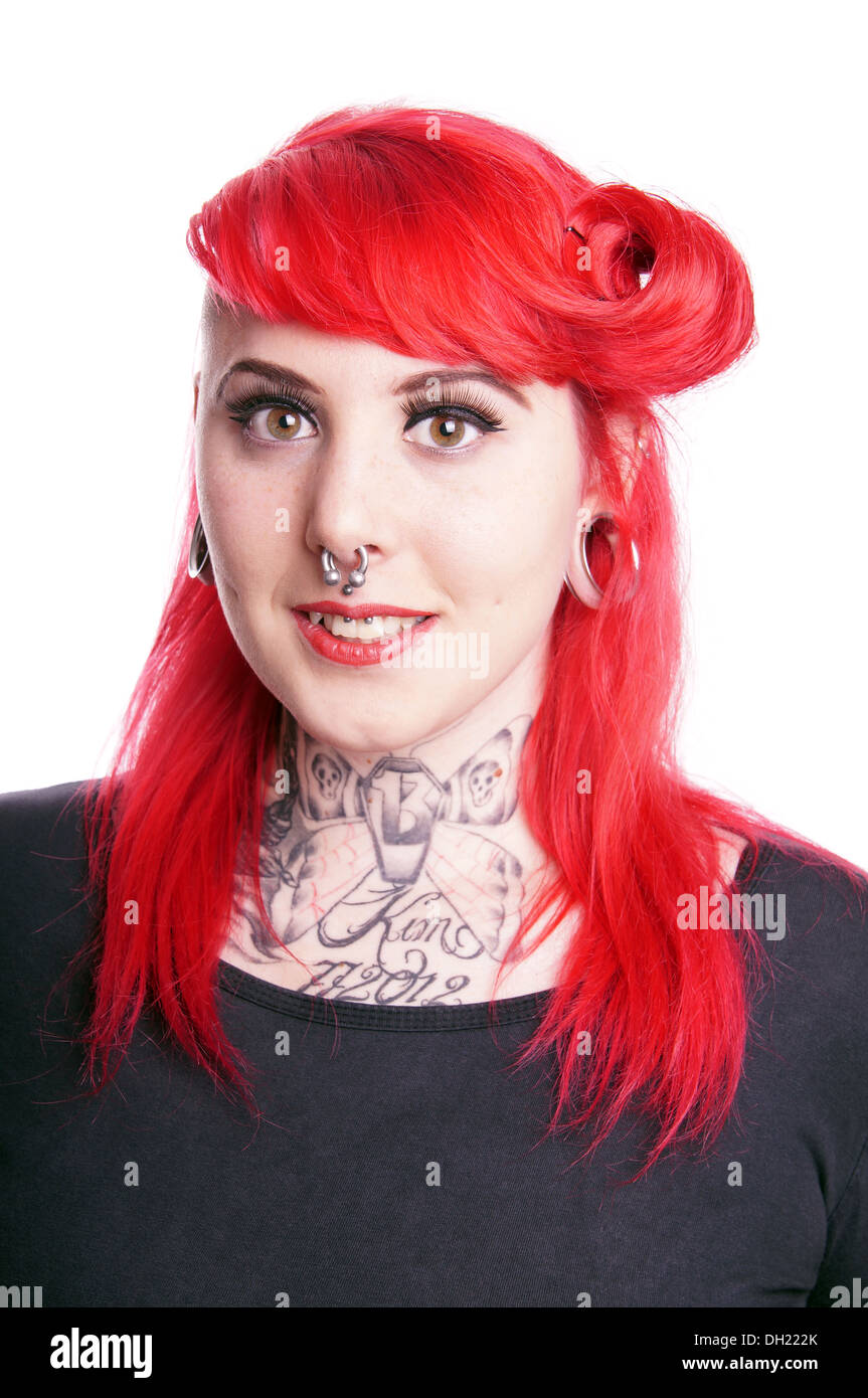 young woman with facial piercings and tattoos Stock Photo