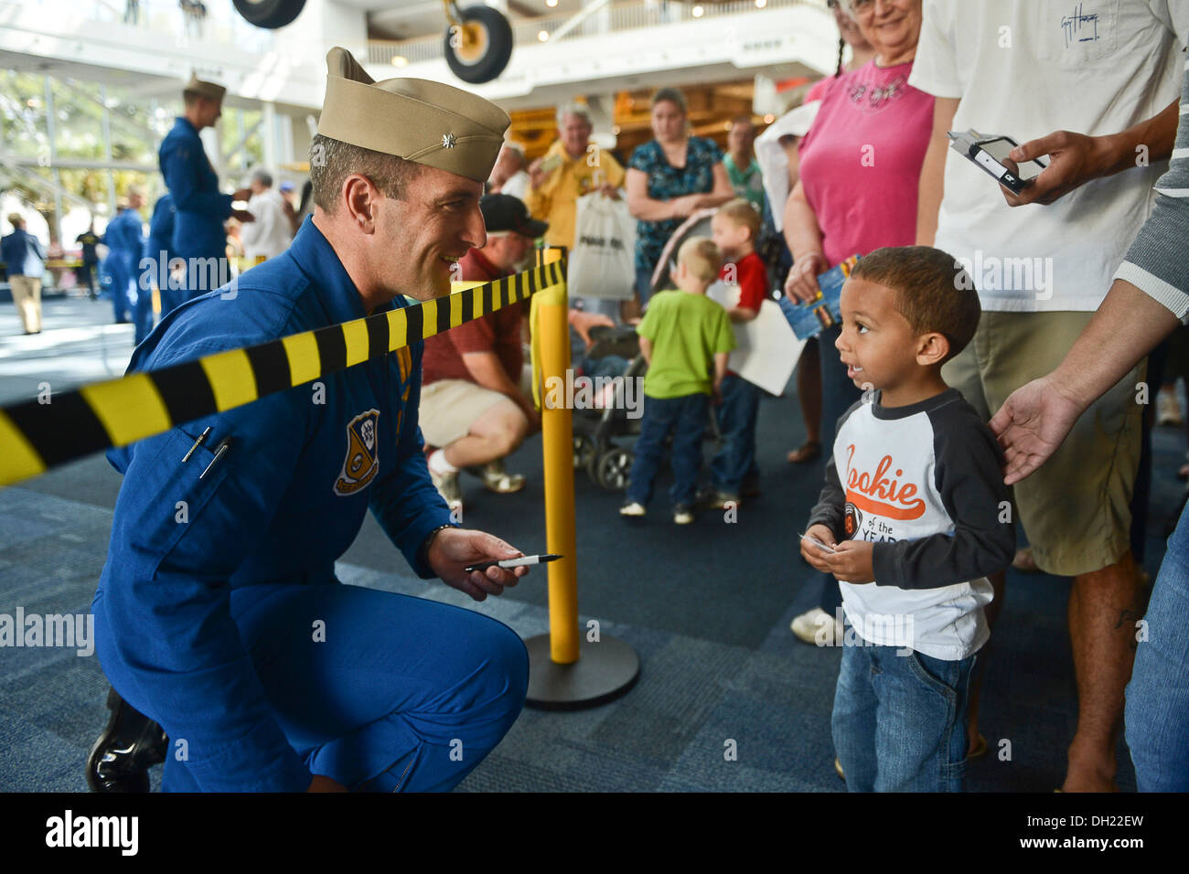 The U.S. Navy Flight Demonstration Squadron, the Blue Angels, commanding officer and flight leader, Cmdr. Thomas Frosch, from Clinton Township, Mich., signs autographs at the National Naval Aviation Museum at Naval Air Station Pensacola. While the U.S. Na Stock Photo
