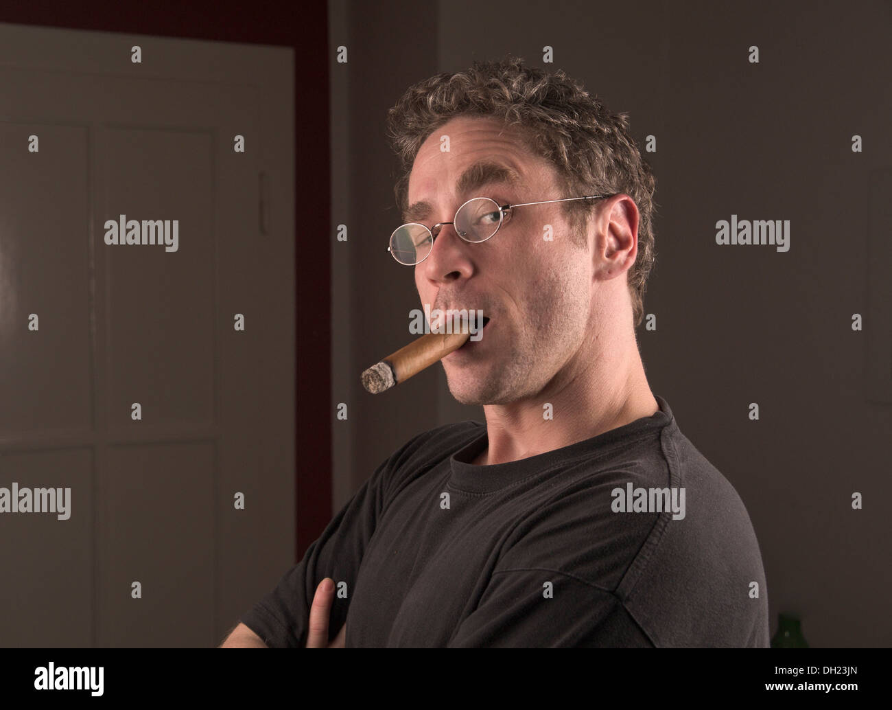 Young man with cigar, portrait Stock Photo