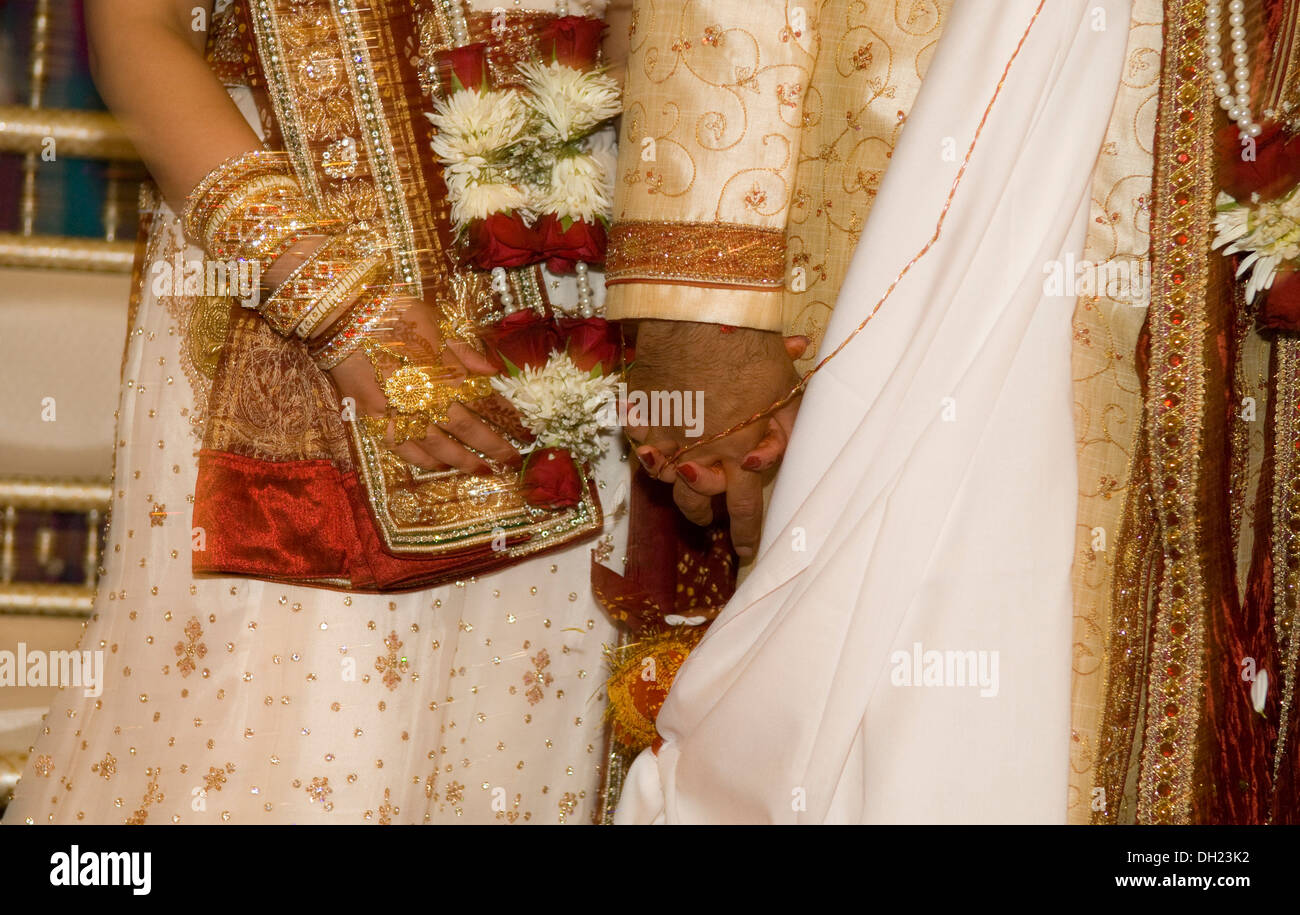 Bride and Groom dressed in all their finery celebrating their