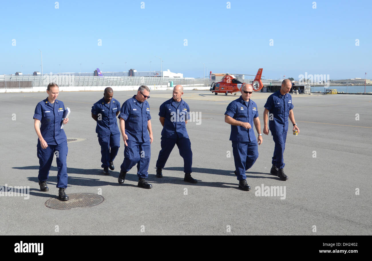 Rear Adm. Charles Ray, Coast Guard Pacific Area deputy commander, is provided a tour by Air Station San Francisco leadership of Stock Photo