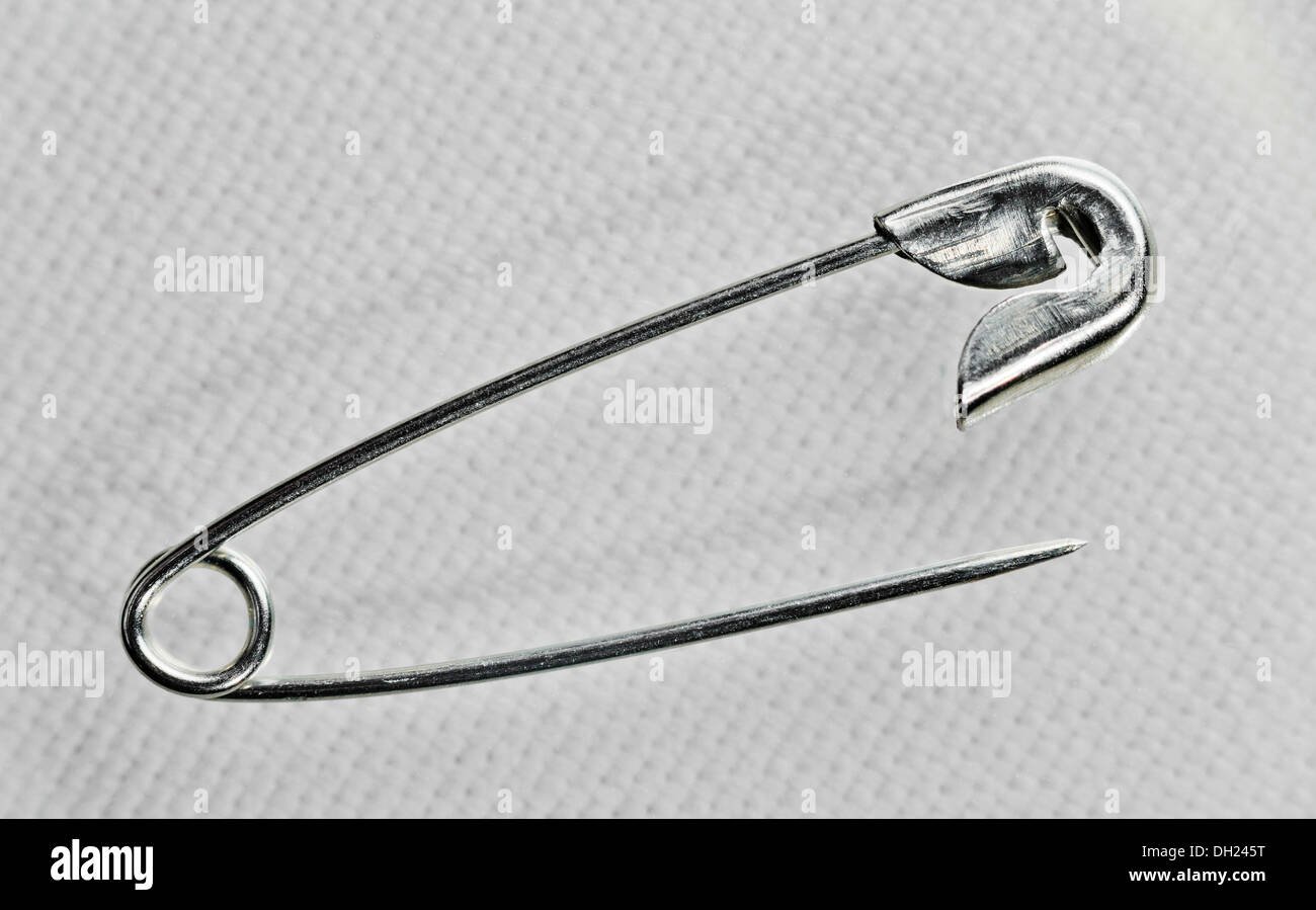 Safety Pin On White Linen Stock Photo Alamy