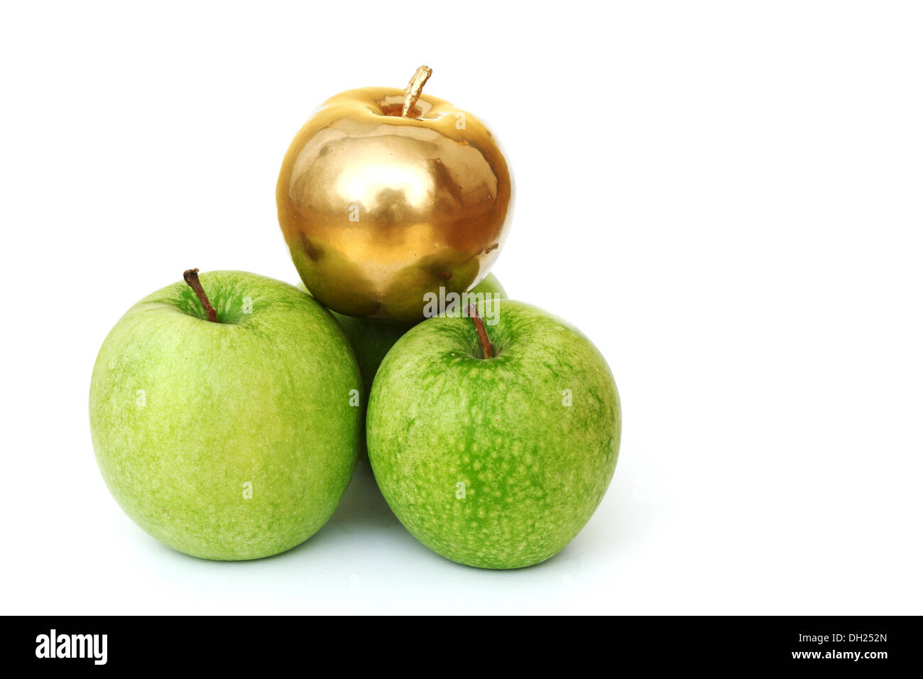 gold and green apples on white background Stock Photo