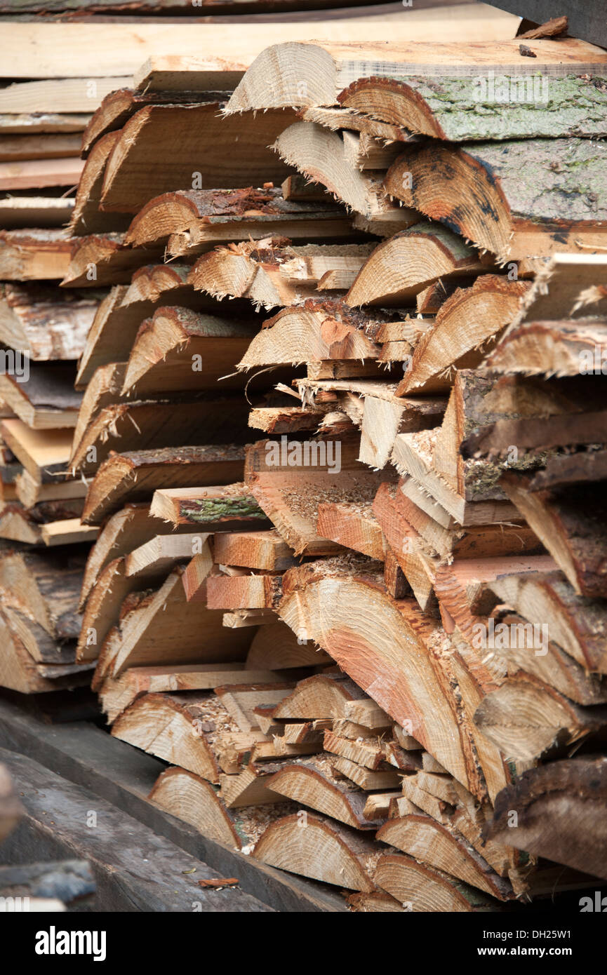 Freshly cut sawn trees timber yard rough Stock Photo