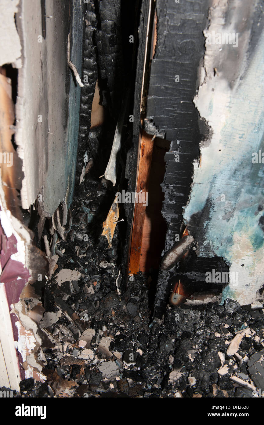 Wood cavity wall void fire spread burnt cut away Stock Photo