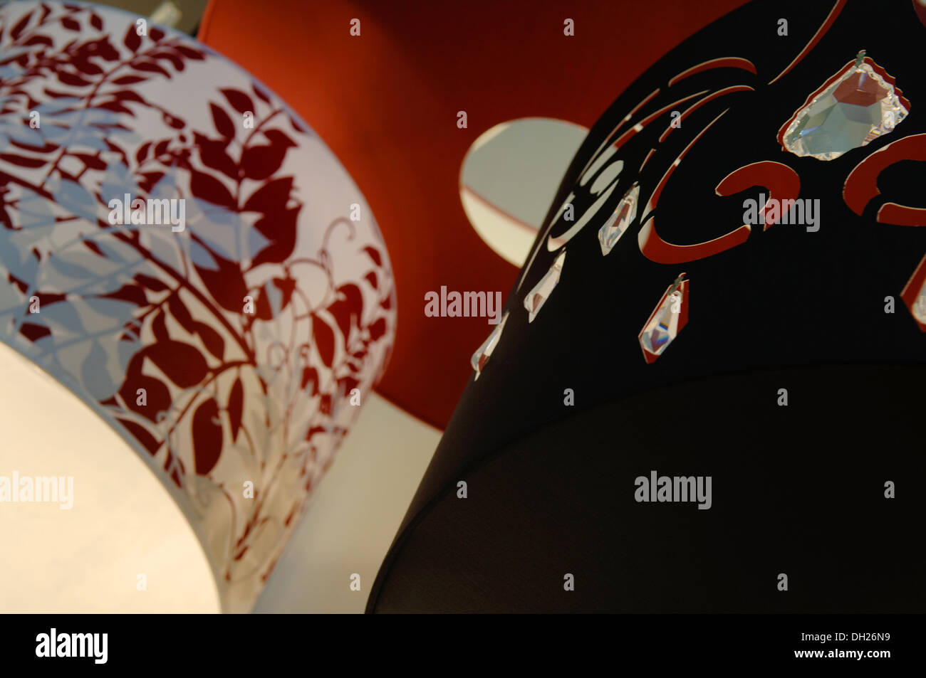 lamp shades of various designs in various colours, black, red white. Stock Photo