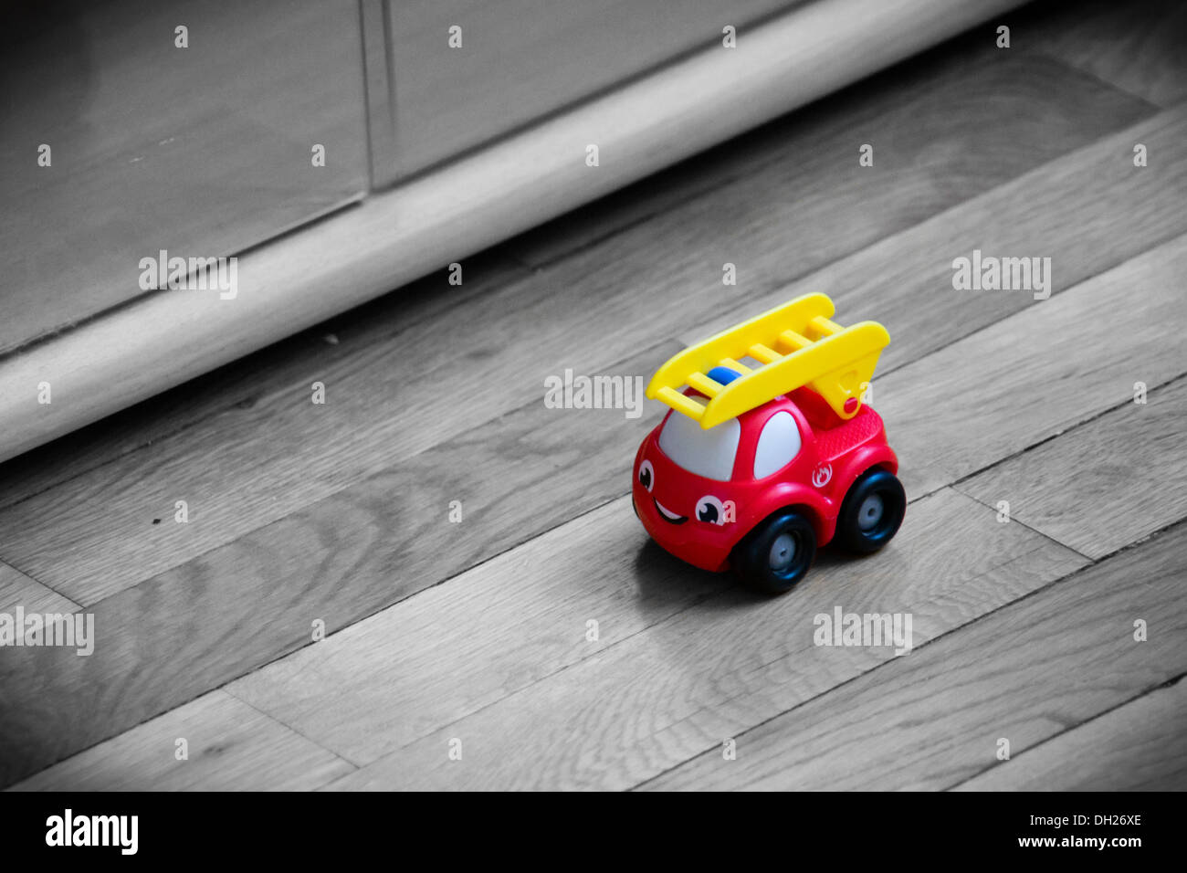 A fire truck toy, on a black and white background Stock Photo