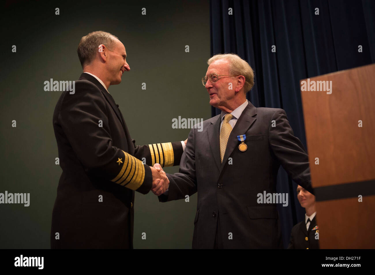 Chief of Naval Operations (CNO) Adm. Jonathan Greenert congratulates retired Adm. James Hogg, director of the CNO Strategic Stu Stock Photo