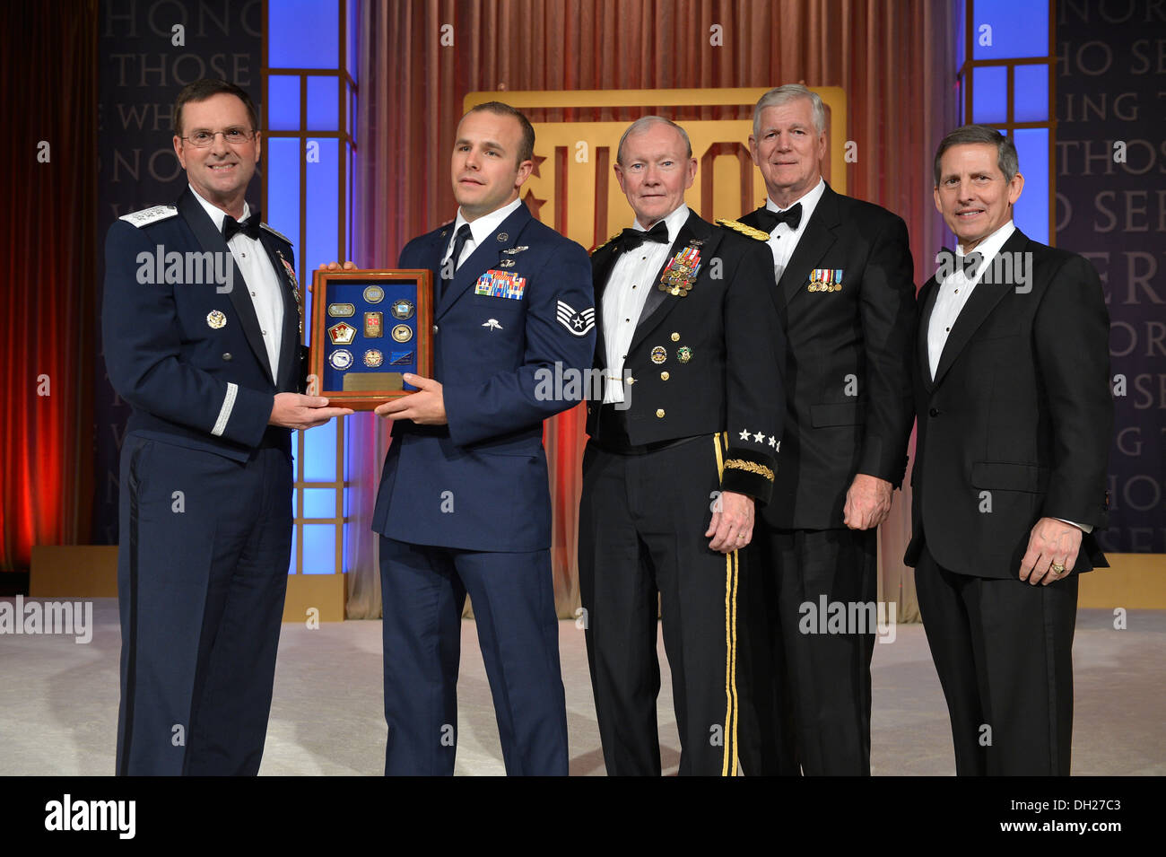 New York Air National Guard Staff Sgt. Christopher Petersen ( second from left) receives a plaque recognizing him as the USO's N Stock Photo