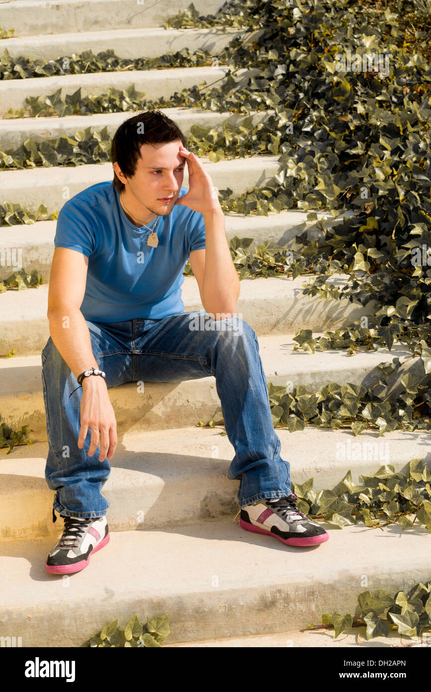 Lonely man sitting on stairs hi-res stock photography and images - Alamy