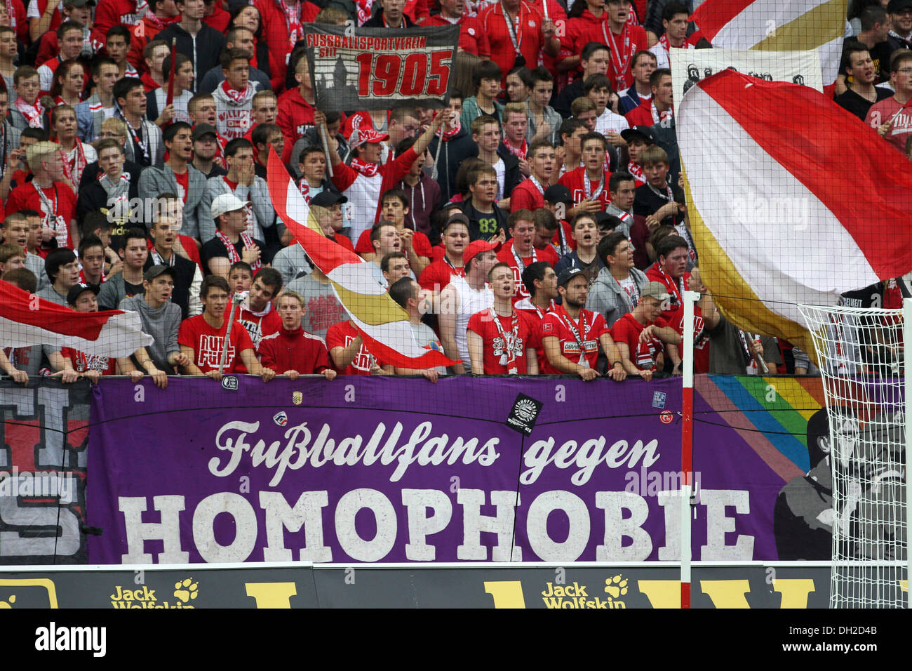 Fans of FSV Mainz 05 football club showing a banner 'Fussballfans gegen Homophobie', German for 'football fans against Stock Photo