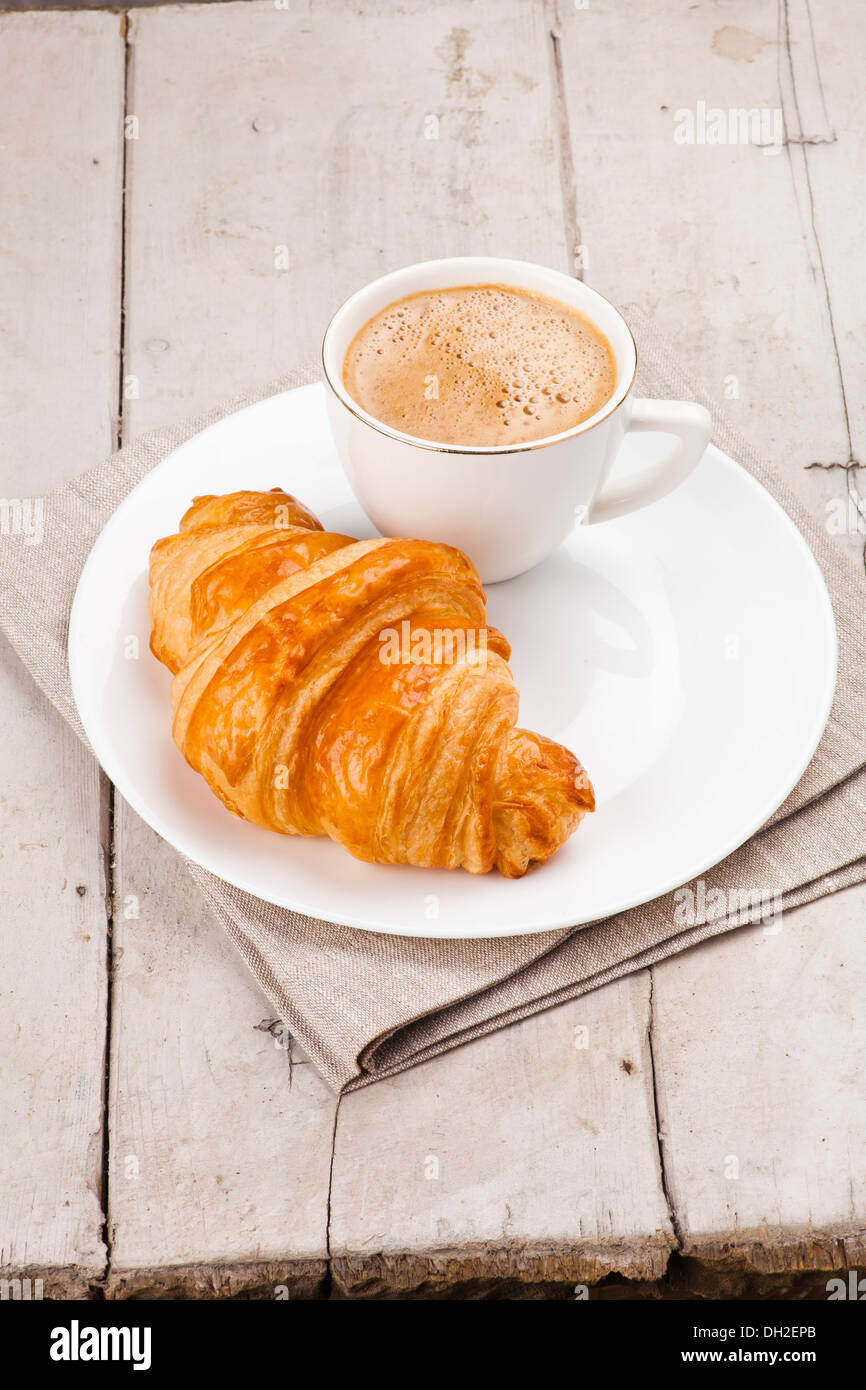 breakfast with croissants, cup of coffee and milk Stock Photo