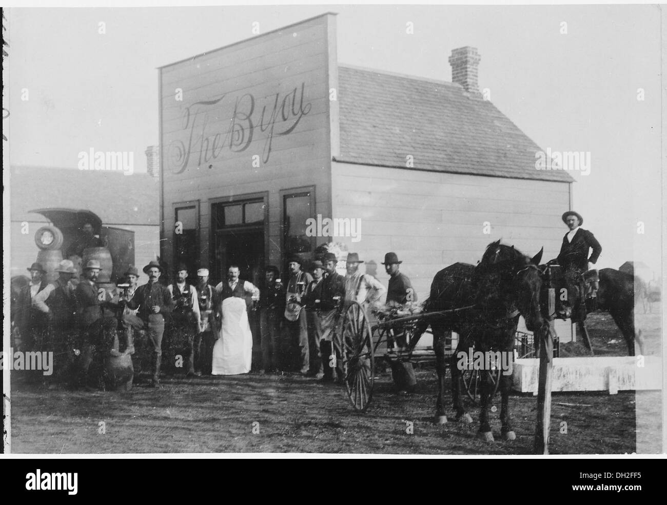 Gathered around the kegs at Kelley's saloon The Bijou. Round Pond, OkIa. Terr. By Kennett, January 1894 540092 Stock Photo