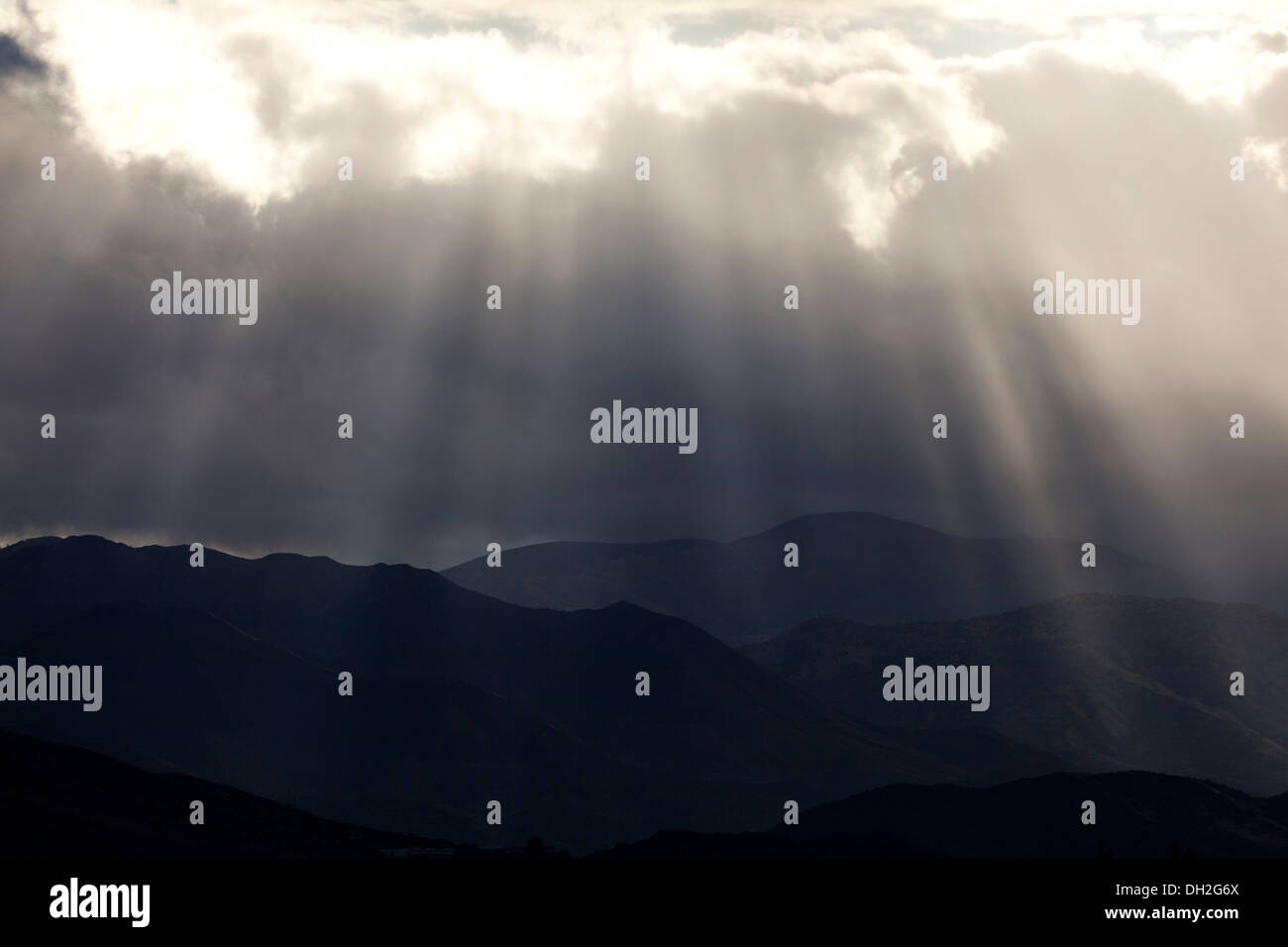 Light rays shining through clouds - California USA Stock Photo