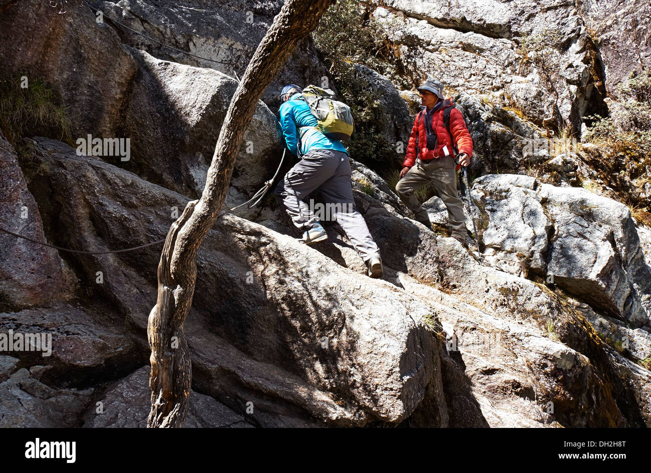 A climber and guide descending the Nev Churup trail, Huascaran National Park in the Andes. Stock Photo
