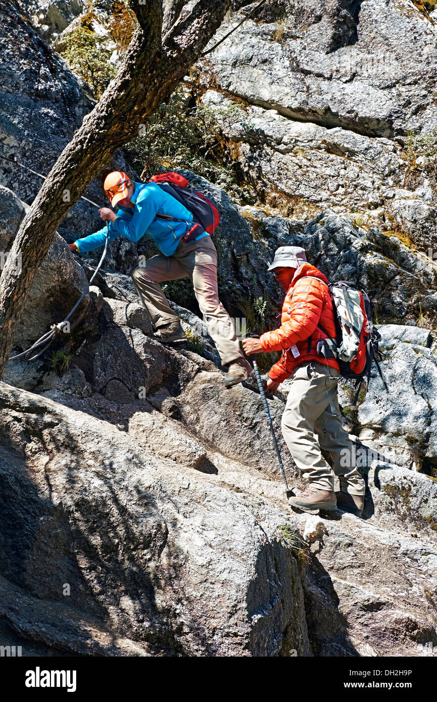 A climber and guide descending the Nev Churup trail, Huascaran National Park in the Andes. Stock Photo