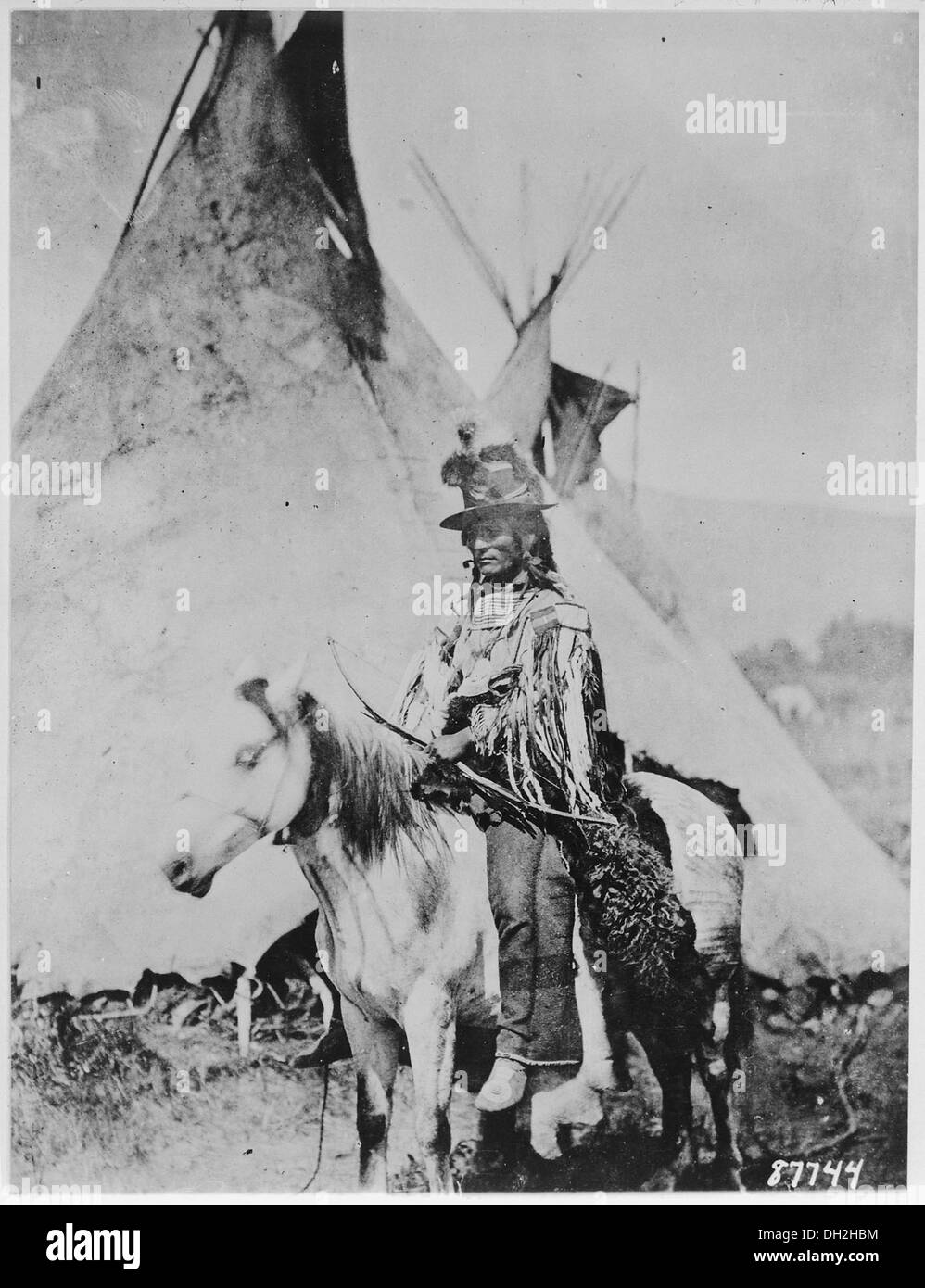 Looking Glass, a Nez Perce' chief, on horseback in front of a tepee, 1877 530914 Stock Photo