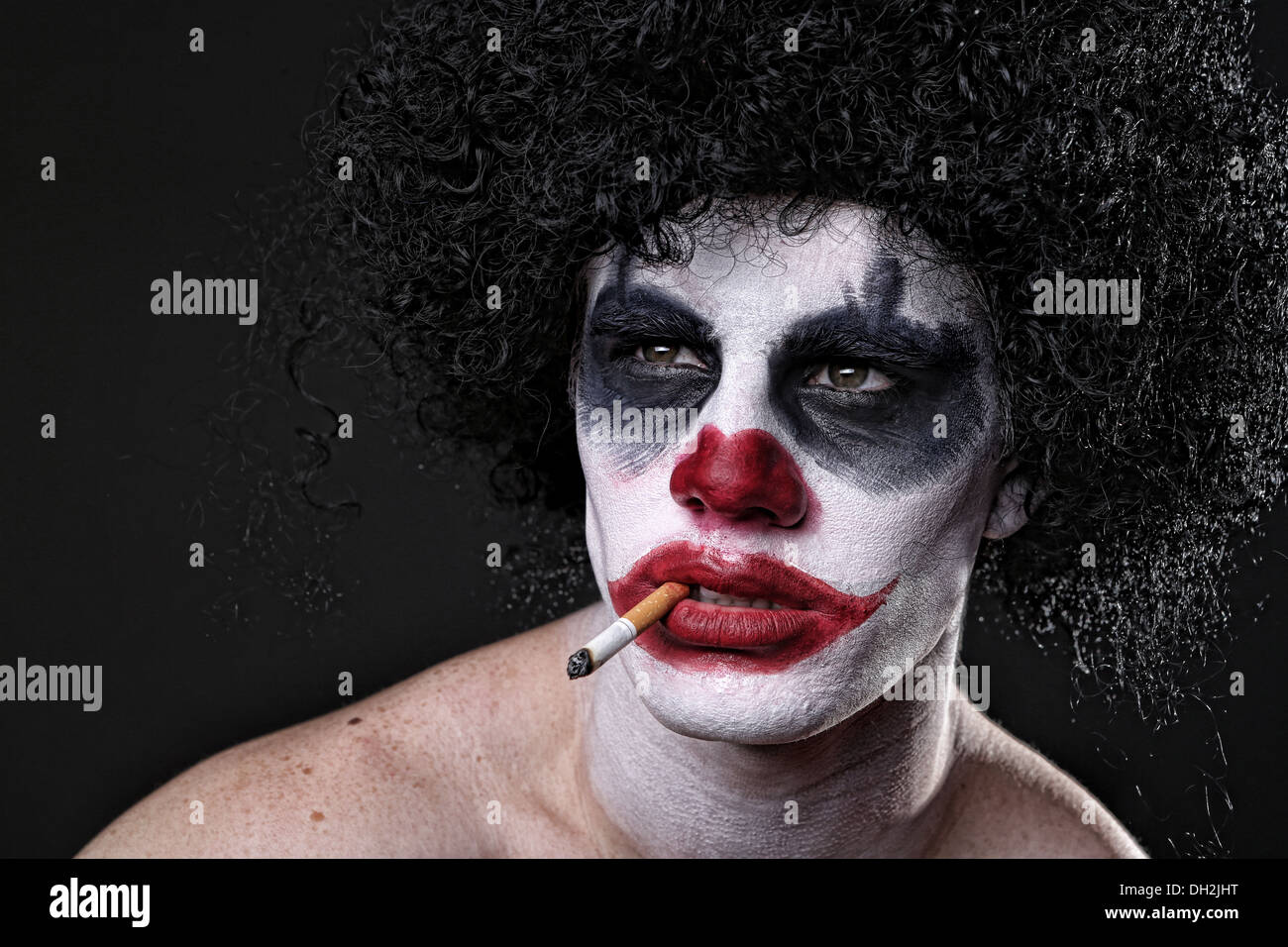 Evil Spooky Clown Portrait on Black Background Stock Photo
