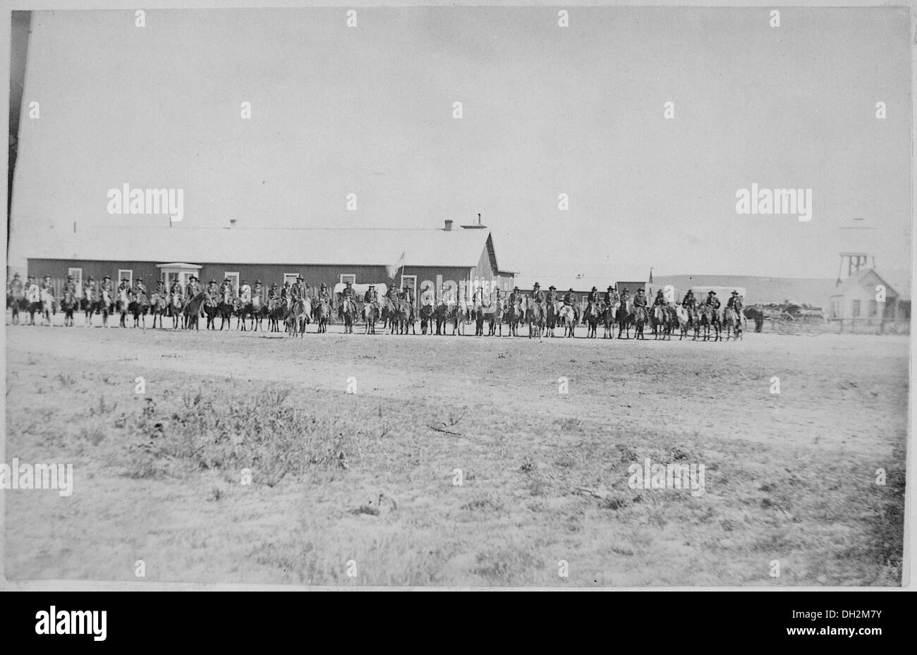 Sioux Indian police lined up on horseback in front of Pine Ridge Agency buildings, Dakota Territory, 08-09-1882 519143 Stock Photo