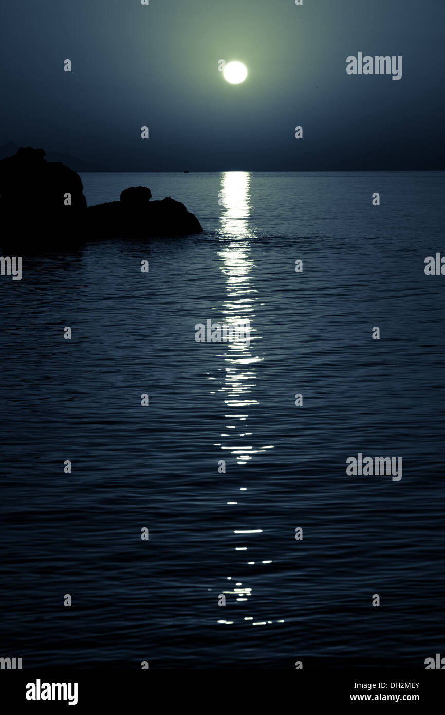reflection of the moon on the sea surface. moonlit path Stock Photo