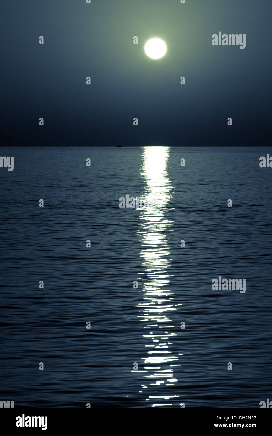reflection of the moon on the sea surface. moonlit path Stock Photo