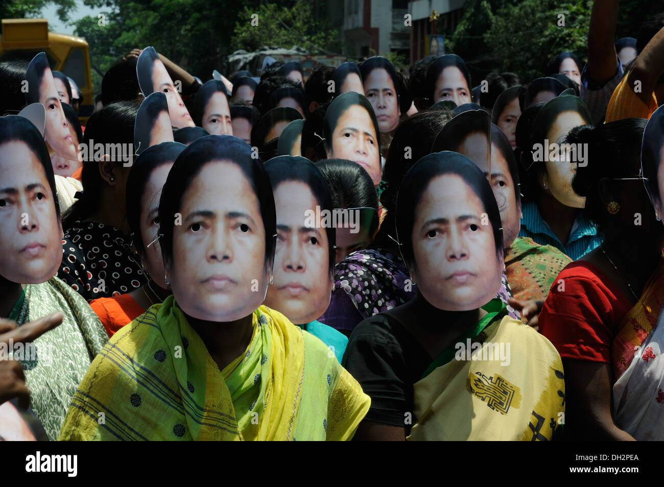 Masks of Mamta Banerjee TMC political party rally Kolkata west bengal India Asia Stock Photo