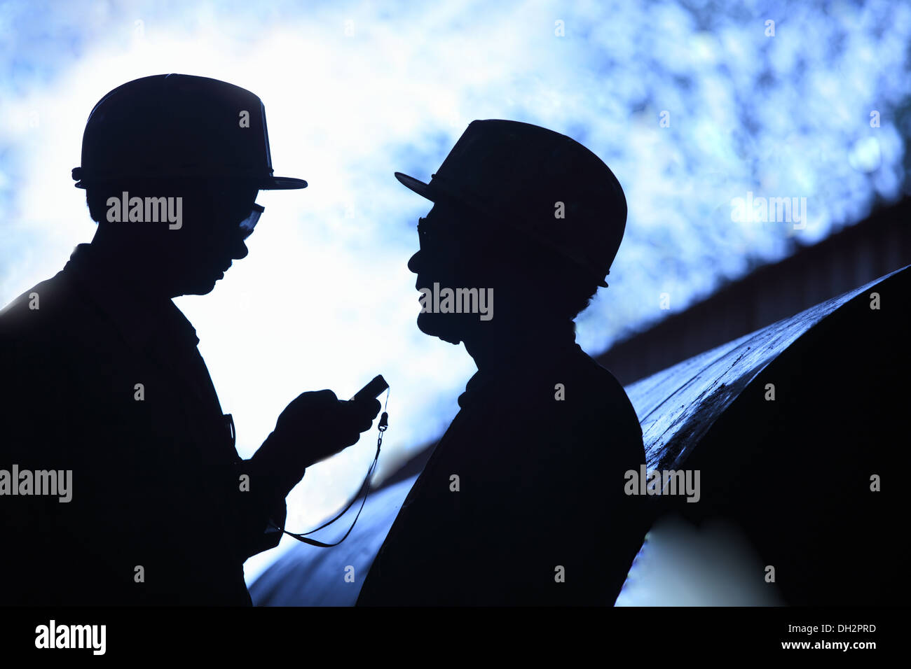 Engineer with mobile phone Stock Photo - Alamy