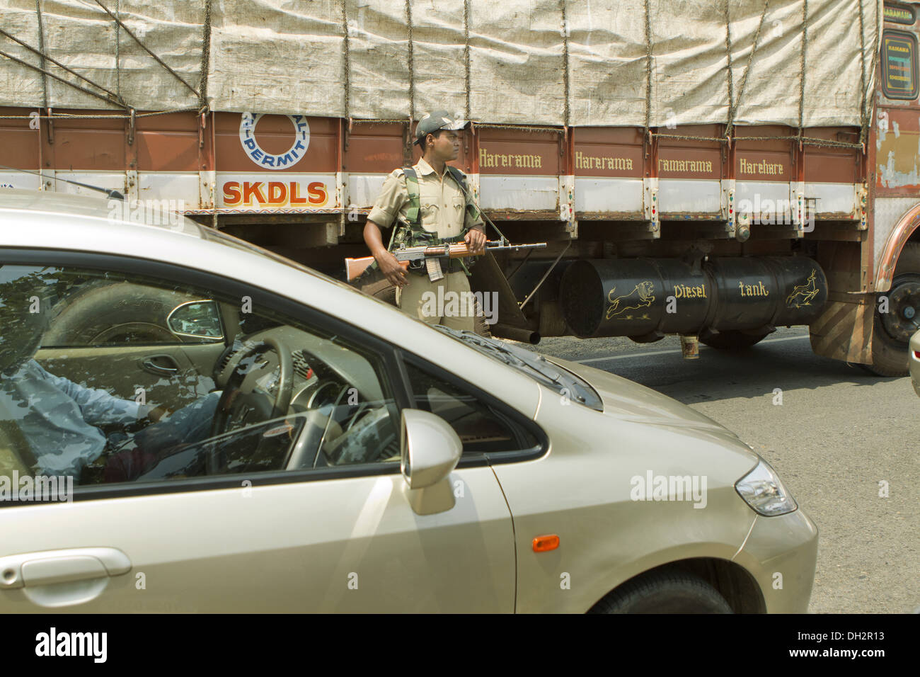 Security Guard regulating traffic on highway of Jharkhand India Asia Stock Photo