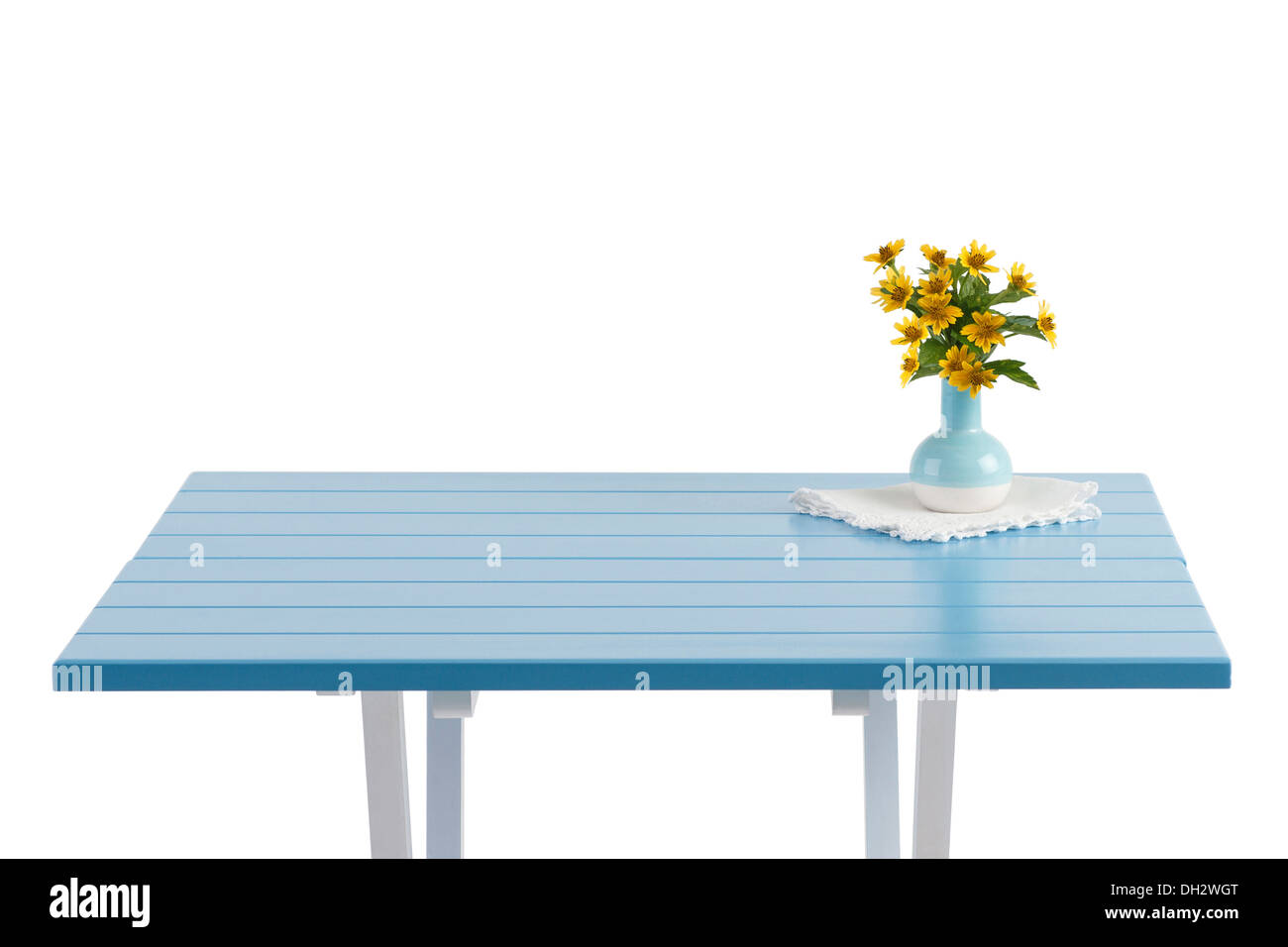Blue wooden table with flowers in vase and empty space Stock Photo