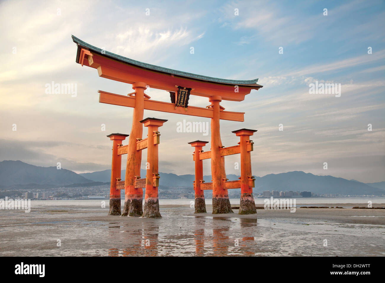 Looming vermilion tori (Shinto gate) Miyajima Island, near Hiroshima, Japan. Stock Photo